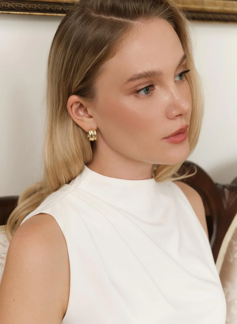 Lichi Half-hoop earrings in textured metal