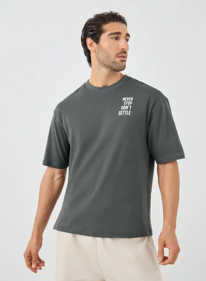 Styli Streetwear Front and Back Slogan Print Oversized Interlock T-Shirt
