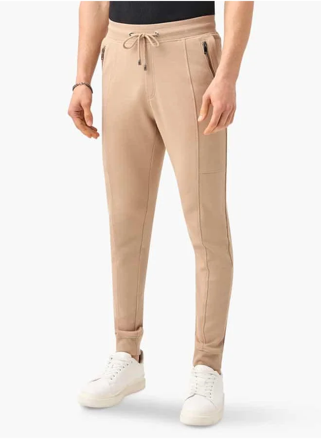 ايكونيك Iconic Panelled Slim Fit Joggers with Drawstring Closure and Pockets