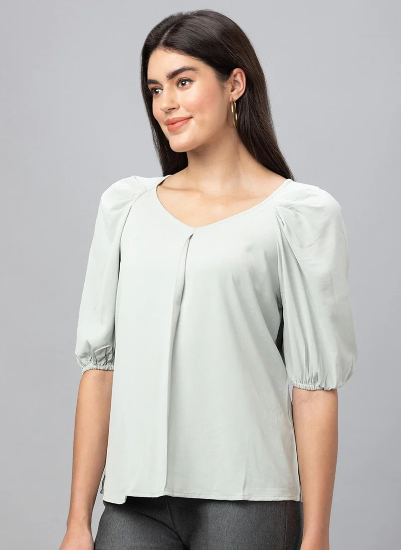 جلو باص بلوزة نسائية خضراء سادة بياقة على شكل حرف