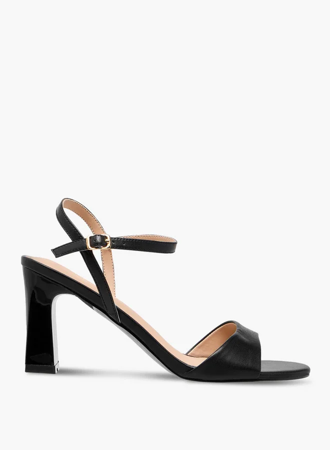 فلورا بيلا من شو إكسبرس Solid Block Heel Sandals with Buckle Closure