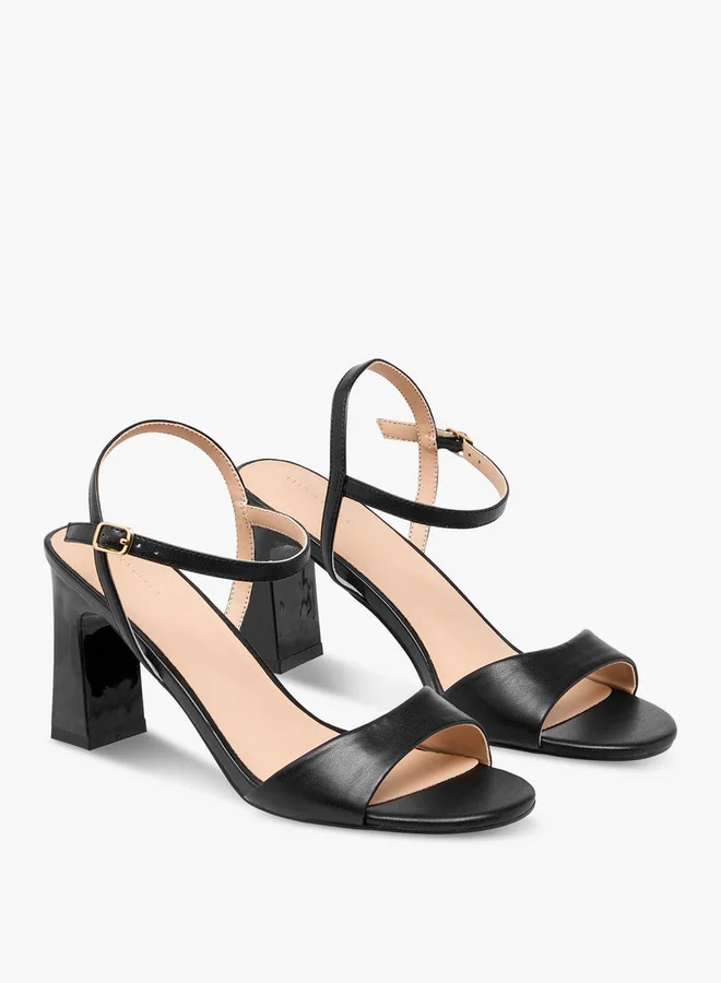 فلورا بيلا من شو إكسبرس Solid Block Heel Sandals with Buckle Closure