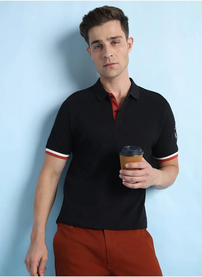 دينيس لينغو Timeless Black Polo T-Shirt for Men featuring a regular fit, solid pique fabric, and a classic polo neckline—perfect for a sophisticated and casual style.