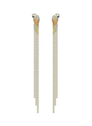 Eye-catching bright blue and yellow crystals form the long tail of a stylized, gold-tone plated parrot