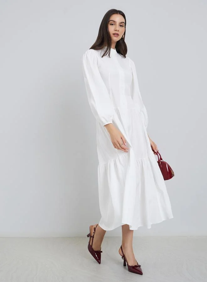 ستايلي فستان ميدي أبيض بأكمام منتفخة وأزرار أمامية