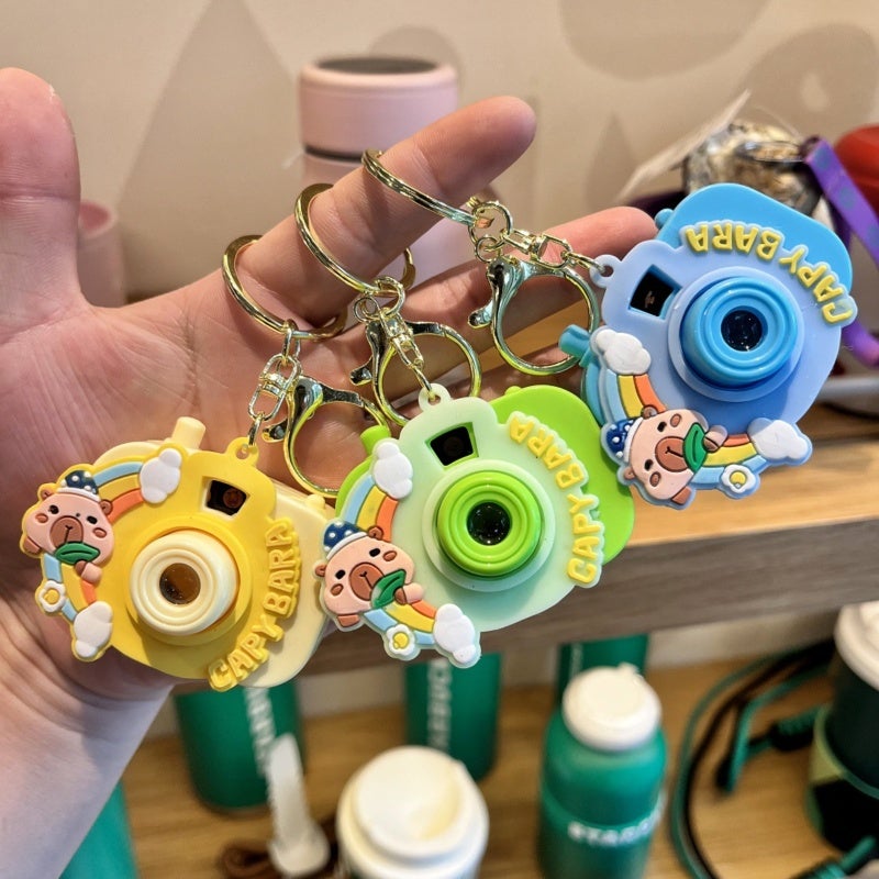 Cartoon Projector Keychain Toy: Durable Plastic Pink2 - Multifunctional Compact Charm for Kids, Cartoon Fans and Bag Accessory Lovers - Image 3