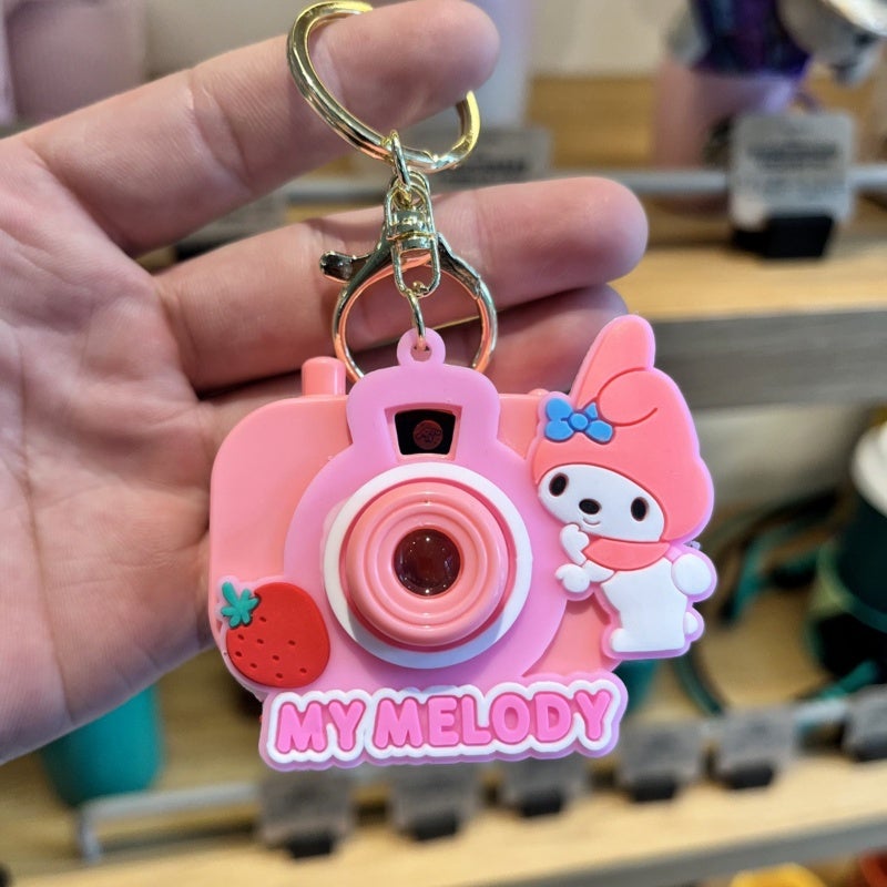 Cartoon Projector Keychain Toy: Durable Plastic Pink2 - Multifunctional Compact Charm for Kids, Cartoon Fans and Bag Accessory Lovers - Image 1
