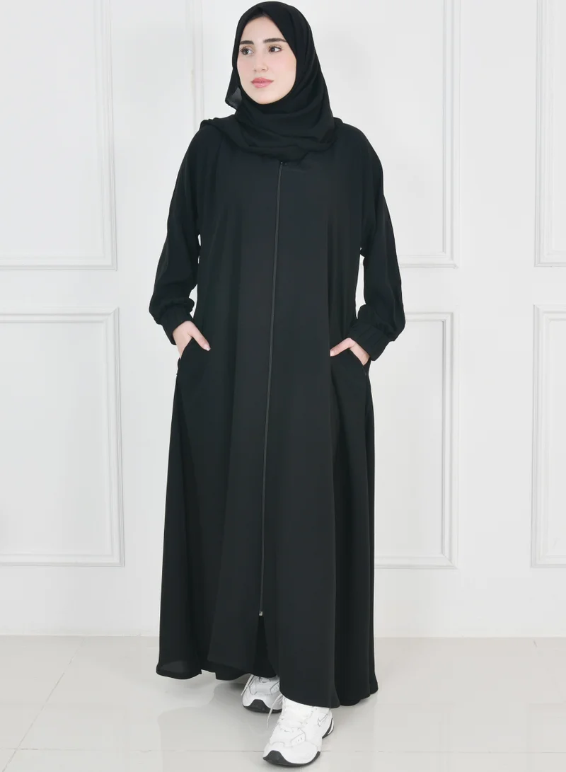 HAWRAA ABAYA Black zippered abaya with narrow pleated sleeves and hidden zippered pockets