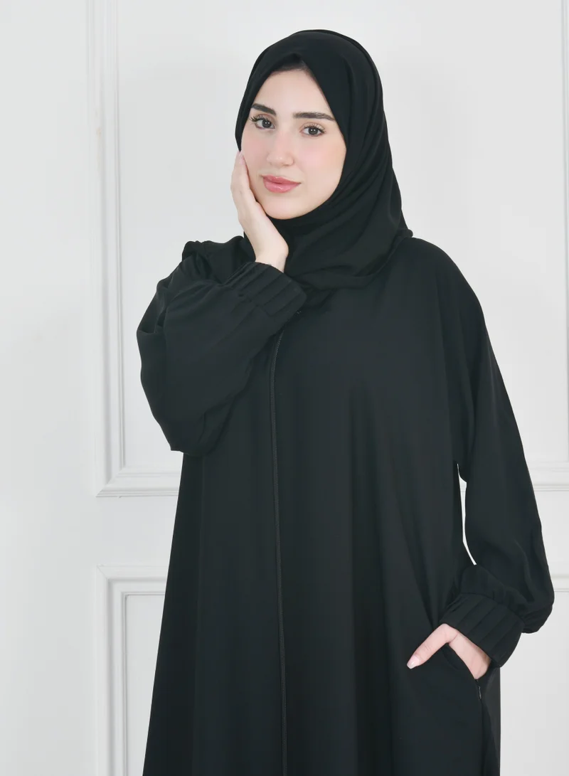 HAWRAA ABAYA Black zippered abaya with narrow pleated sleeves and hidden zippered pockets