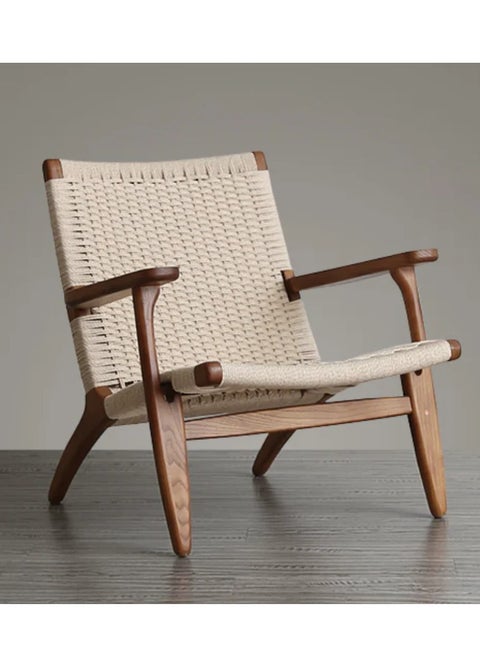 A living room chair made of beech wood and rattan with a streamlined design and a distinctive wooden color