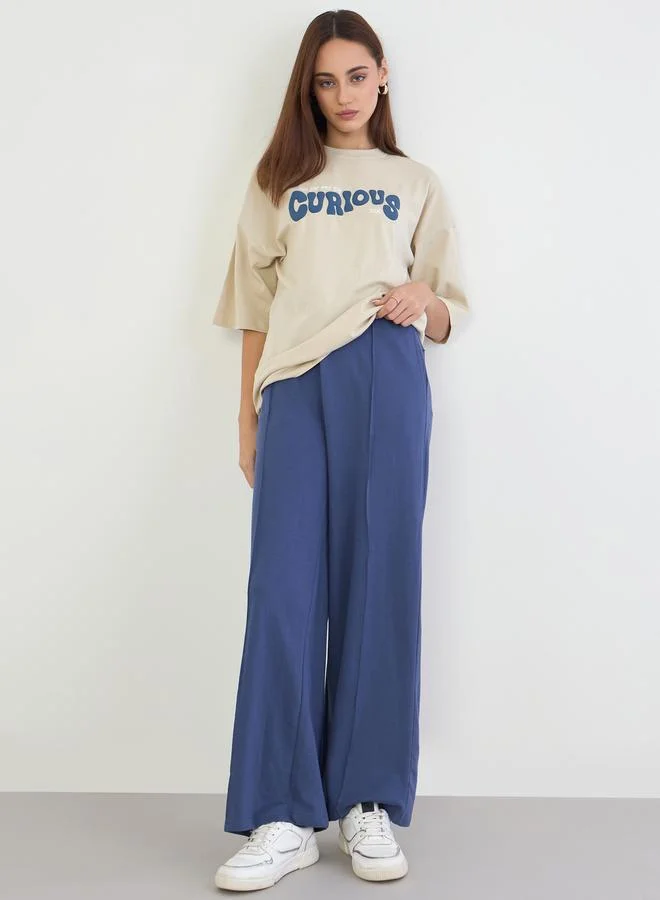 ستايلي تيشيرت واسع بطبعة كتابة