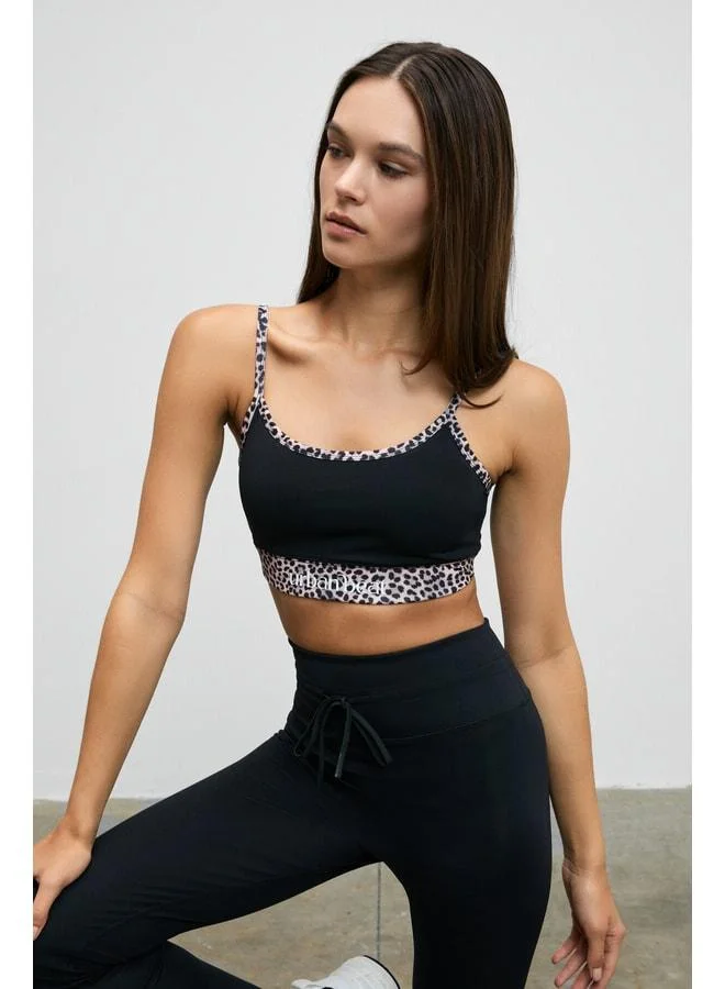 Urban Beat METREON Women's Soft Stretch-Textured Leopard-Contrast Padded Strappy Black Sports Bra.