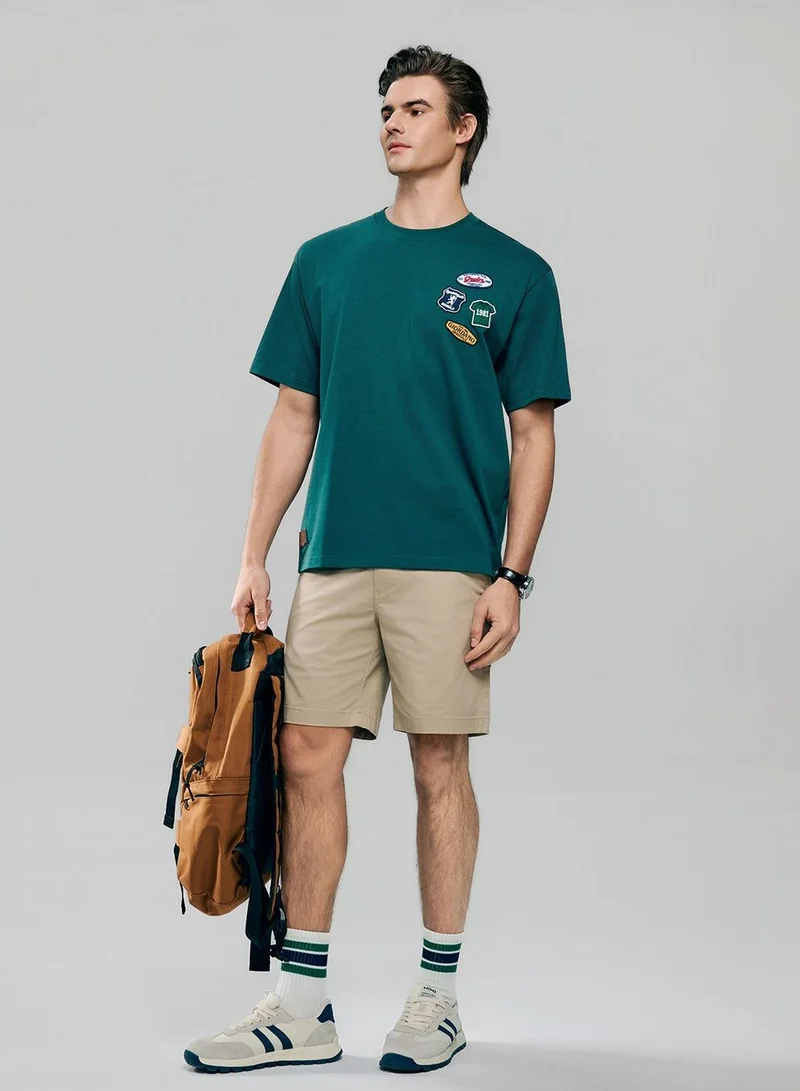 GIORDANO  Men's Relaxed Fit Multi-Badge Graphic Tee for Men | Best Price UAE