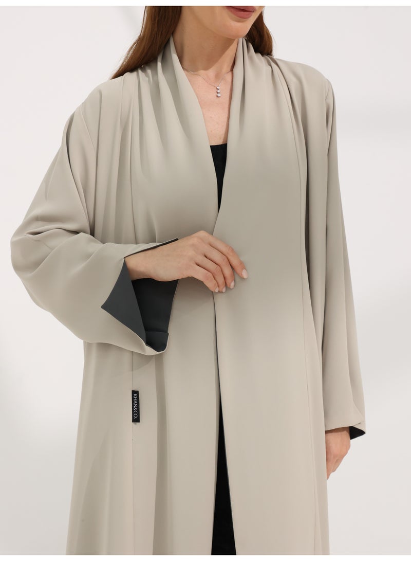 Khan&Co. Sun&Moon BeigeGrey Sun&Moon BeigeGrey Abaya in beige and grey in comfortable buttery fabric - with concealed stitching - by Abdullah Khan - Image 1