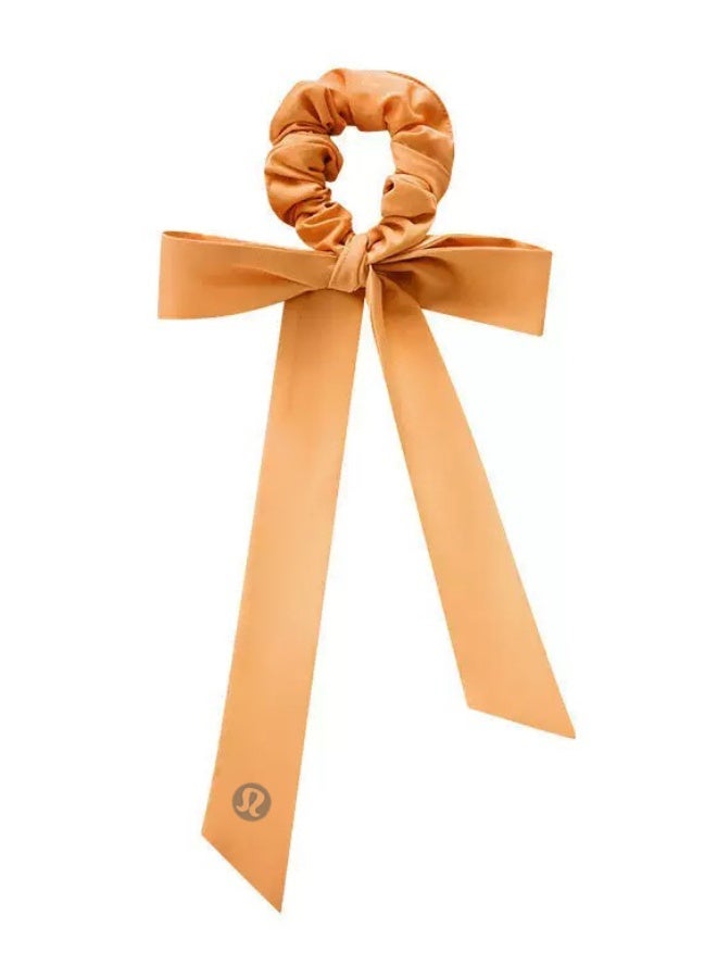 لولوليمون Lululemon satin tight headband with bow tie - a signature hair accessory for yoga, gym, and daily styling - Image 1