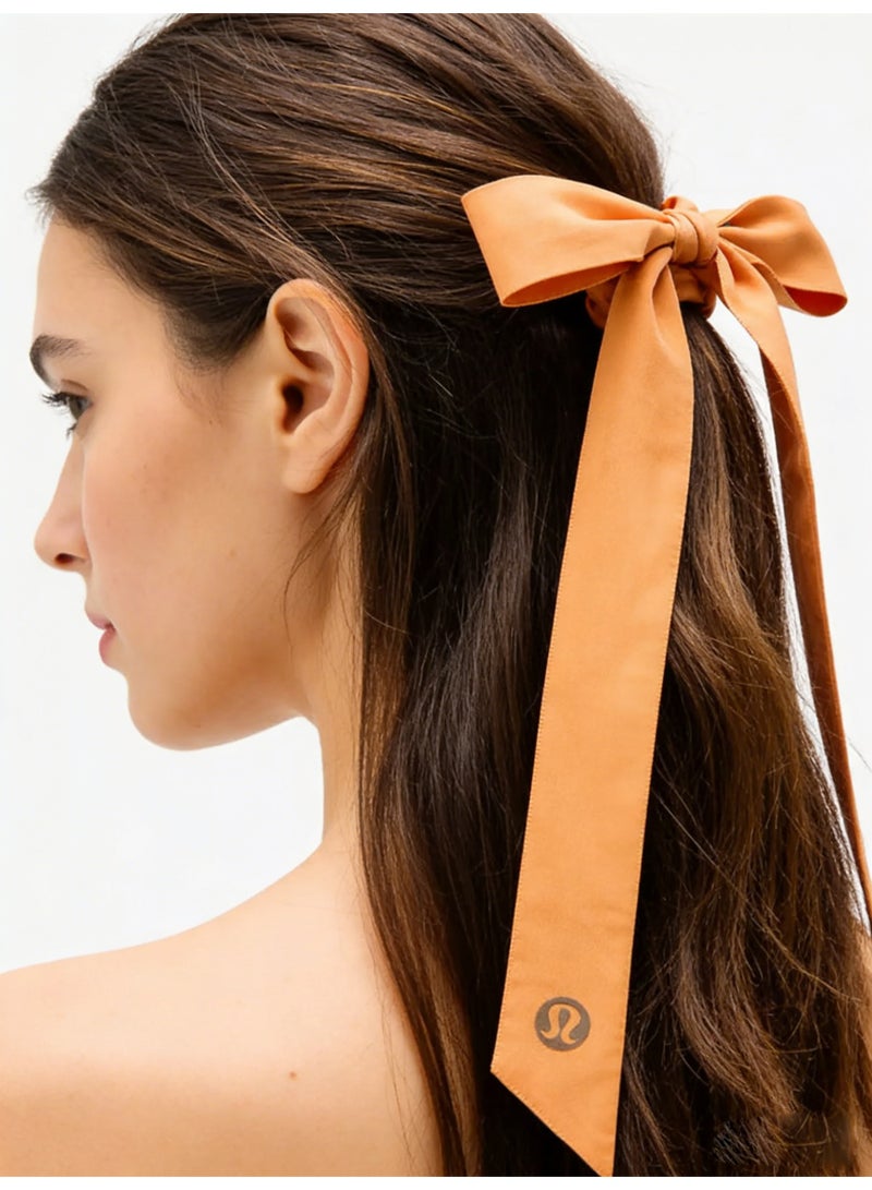 لولوليمون Lululemon satin tight headband with bow tie - a signature hair accessory for yoga, gym, and daily styling - Image 2