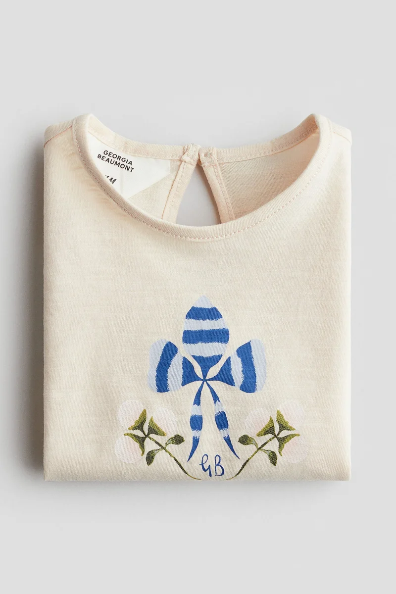 اتش اند ام بلوزة قطنية بطبعة