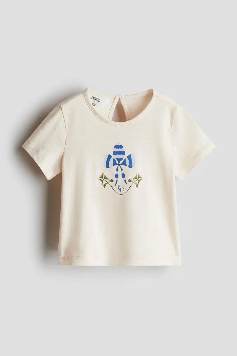 اتش اند ام بلوزة قطنية بطبعة