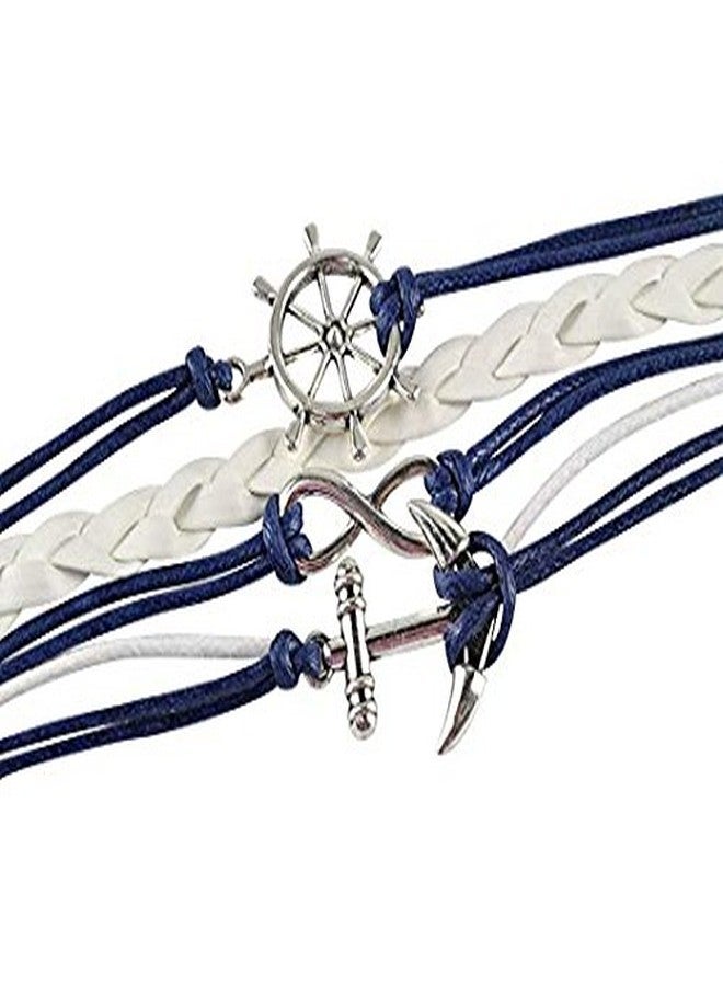 إنفينيتي كوليكشن أقراط وسوار بتصميم مرساة بحرية من مجموعة إنفينيتي للنساء، سوار مضفر باللونين الكحلي والأبيض، حبل جلدي منسوج مزين بعجلة قيادة سفينة ودلايات مرساة - Image 2