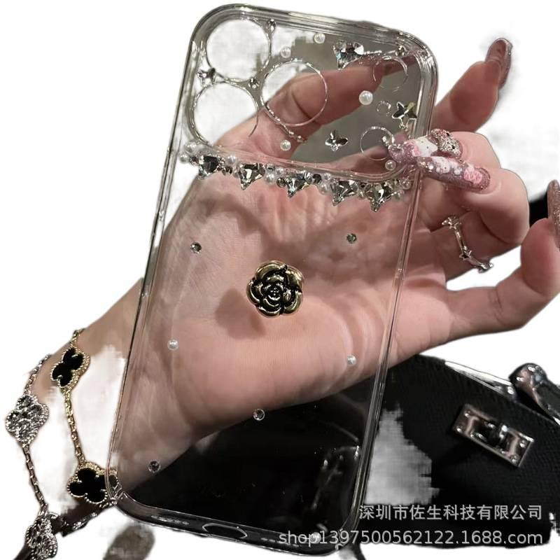غطاء واقي بPC لـ iPhone 16 / 16 Plus / 16 Pro / 16 Pro Max مع حماية من السقوط وخرز ماسي لامع مع مقاوم للصدمات مع نقش زهرة الكاميليا باللون شفاف بتصميم زهري - Image 1