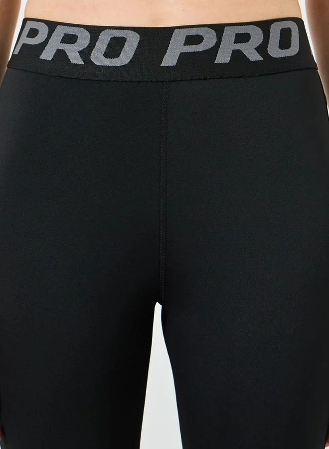 Styli Active  Text Taping Waist Side Slit Flare Leggings for Women | Best Price UAE