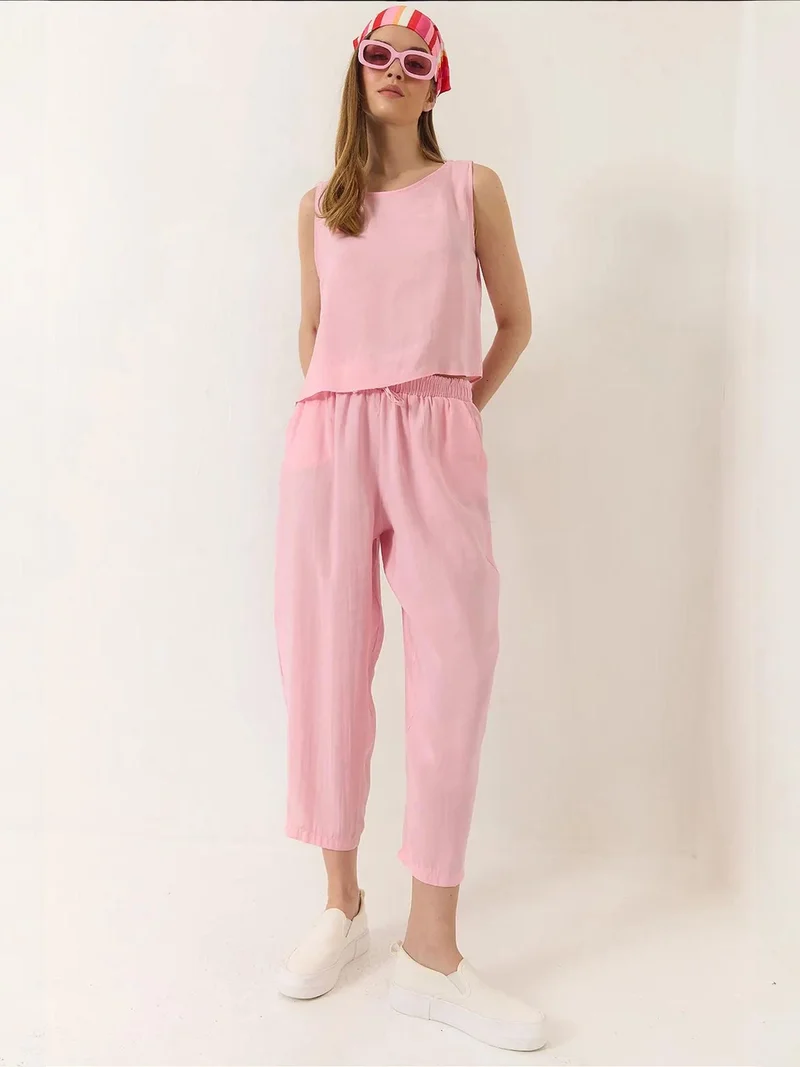 بيانكو لوتشي طقم تونيك بدون أكمام بياقة دائرية وبنطلون واسع الساق من لوتشي