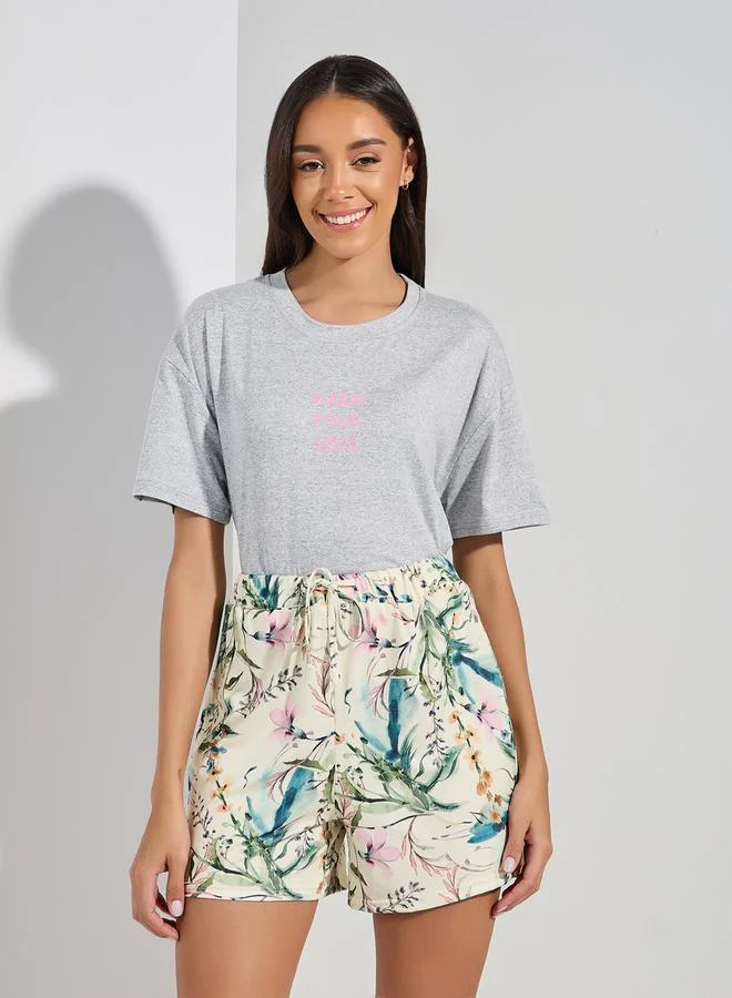 Styli Drop Shoulder Slogan T-Shirt &  Floral Shorts Set