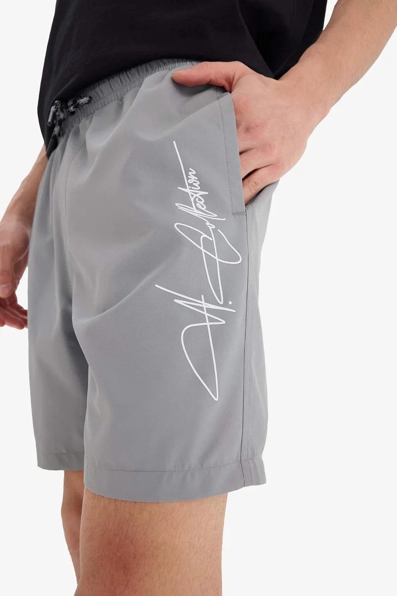 Defacto  Regular Fit Mesh Lined Short Length Swim Shorts for Men | Best Price UAE