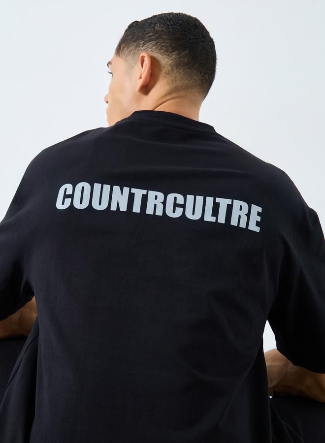 ستايلي تيشيرت رجالي أسود مطبوع بشعار مقاس كبير - Image 1