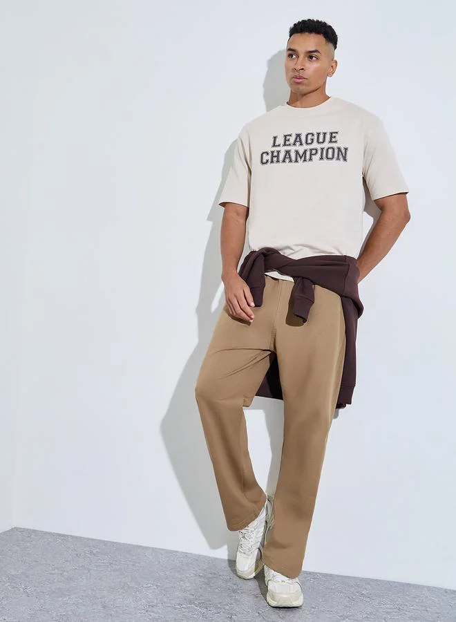 Styli Beige Slogan Print Crew Neck Oversized T-Shirt