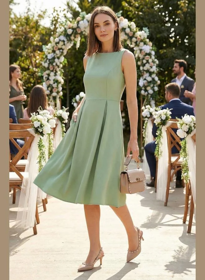 ليلا فستان ميدي بكسرات بقصة عادية بياقة دائرية وجيب للنساء