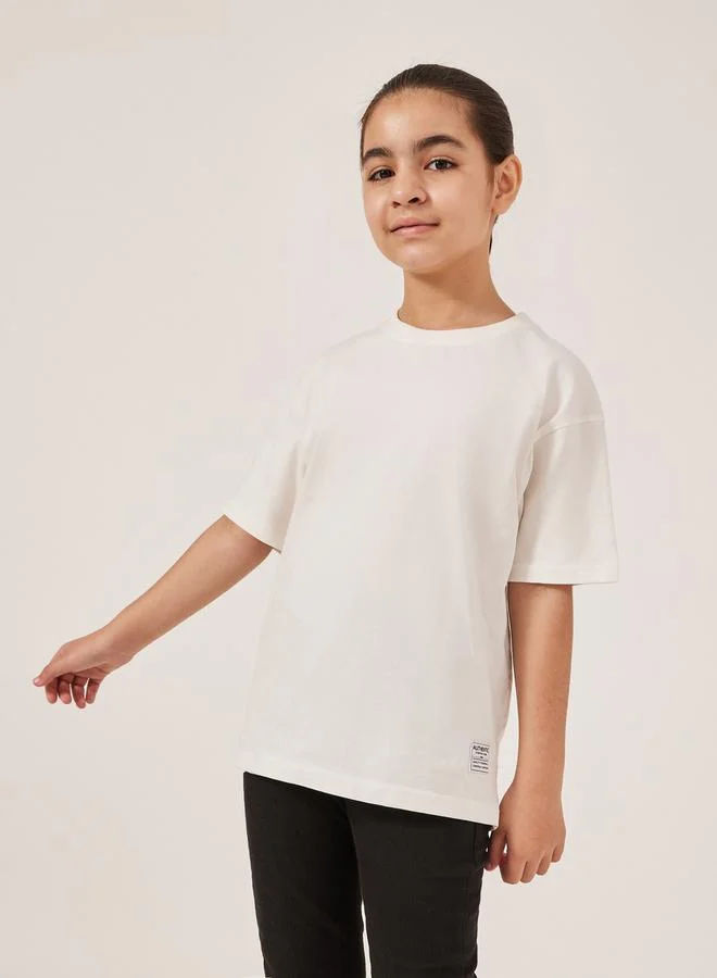Styli Styli Solid Oversized T-Shirt with Badge Detail