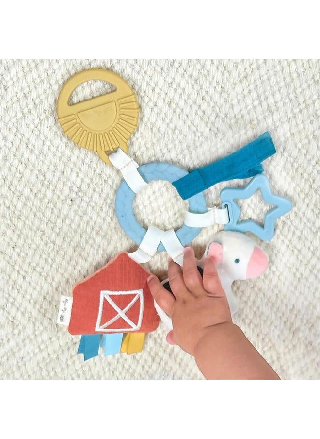 Itzy Ritzy Itzy Ritzy Teething Activity Toy - Bitzy Busy Ring Infant Teething Toy Features Braided Ring & Dangling Toys, Includes Teether, Textured Ribbons, Crinkle Sound & Jingle Bell - 0 Months & Up (Farm)  - Image 1