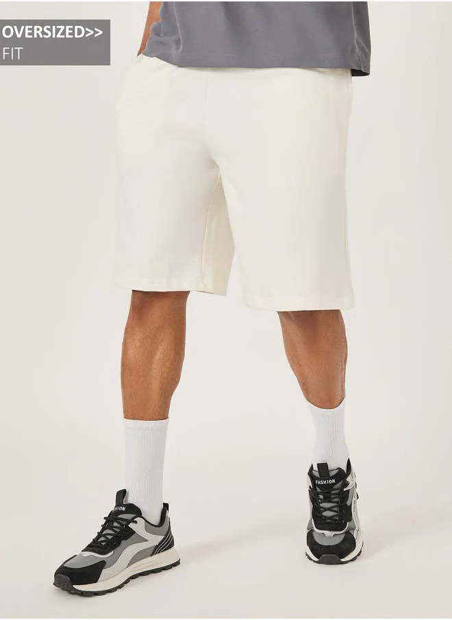 ستايلي Styli Oversized Solid Shorts with Drawstring