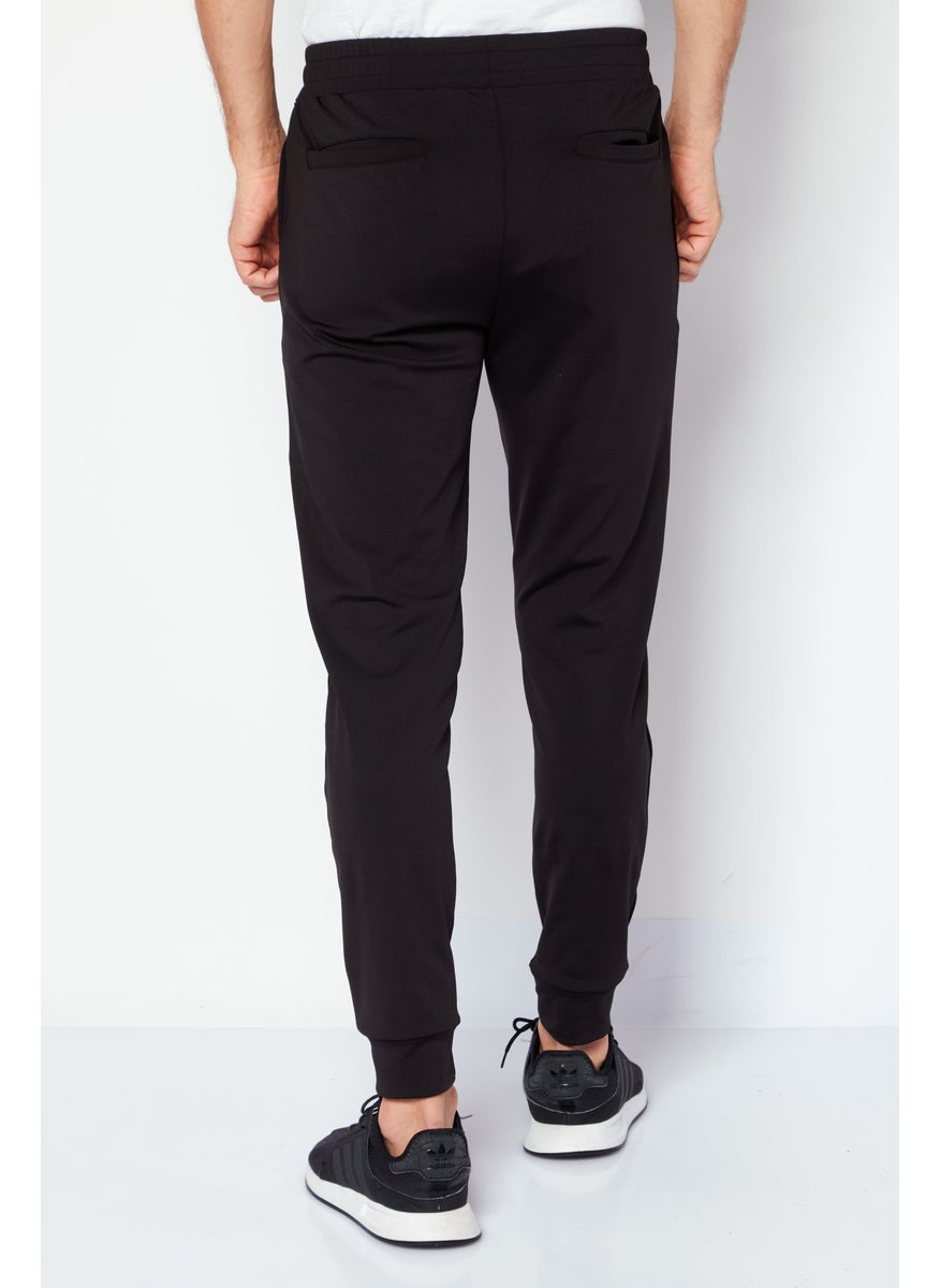 TapouT - Men Regular Fit Brand Logo Jogger Pants, Black - Image 1