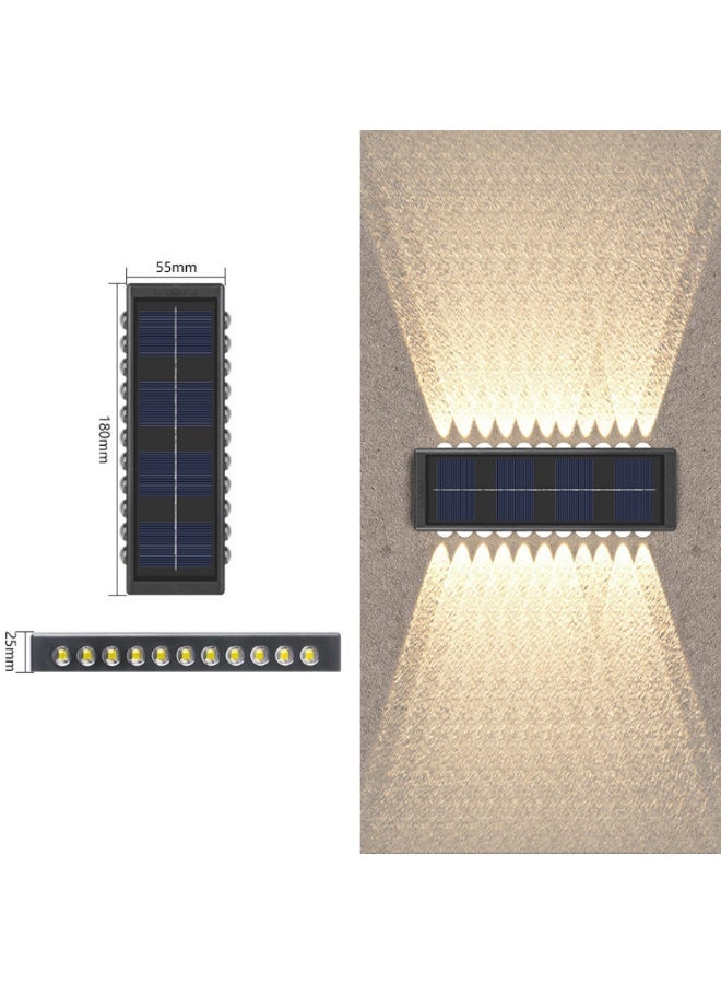 مصباح جدار شمسي – مصباح جدار خارجي زخرفي للأسوار، يتميز بإضاءة علوية/سفلية. مزود بعدسة محدبة بـ 22 مصباح LED مع ضوء دافئ، يعمل ببطارية نيكل-هيدريد معدني (أسود، عبوة من قطعتين). - Image 2