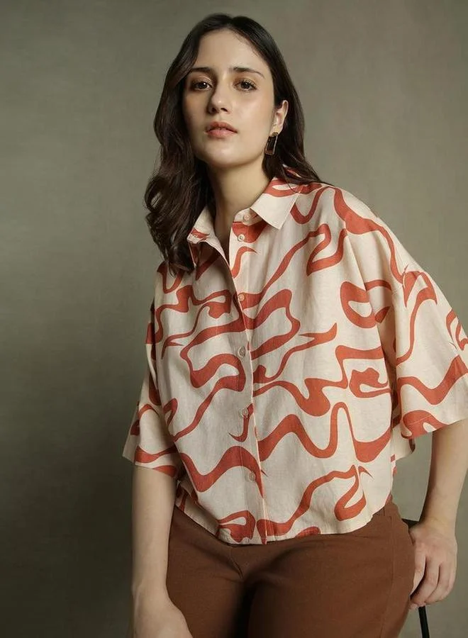 دينيس لينغو بلوزة بوكسي برتقالي بطبعة تجريدية