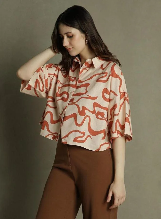 دينيس لينغو بلوزة بوكسي برتقالي بطبعة تجريدية