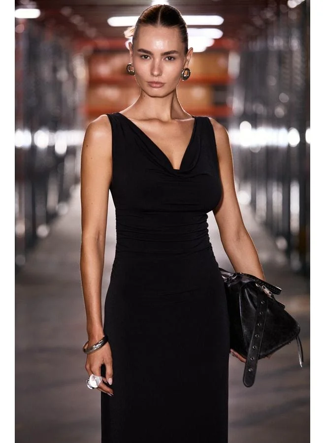 GRIMELANGE ANYA Women's Soft Flexible Fabric Body-Fitting Dress with Pleated Details and Degage Neckline in Black.