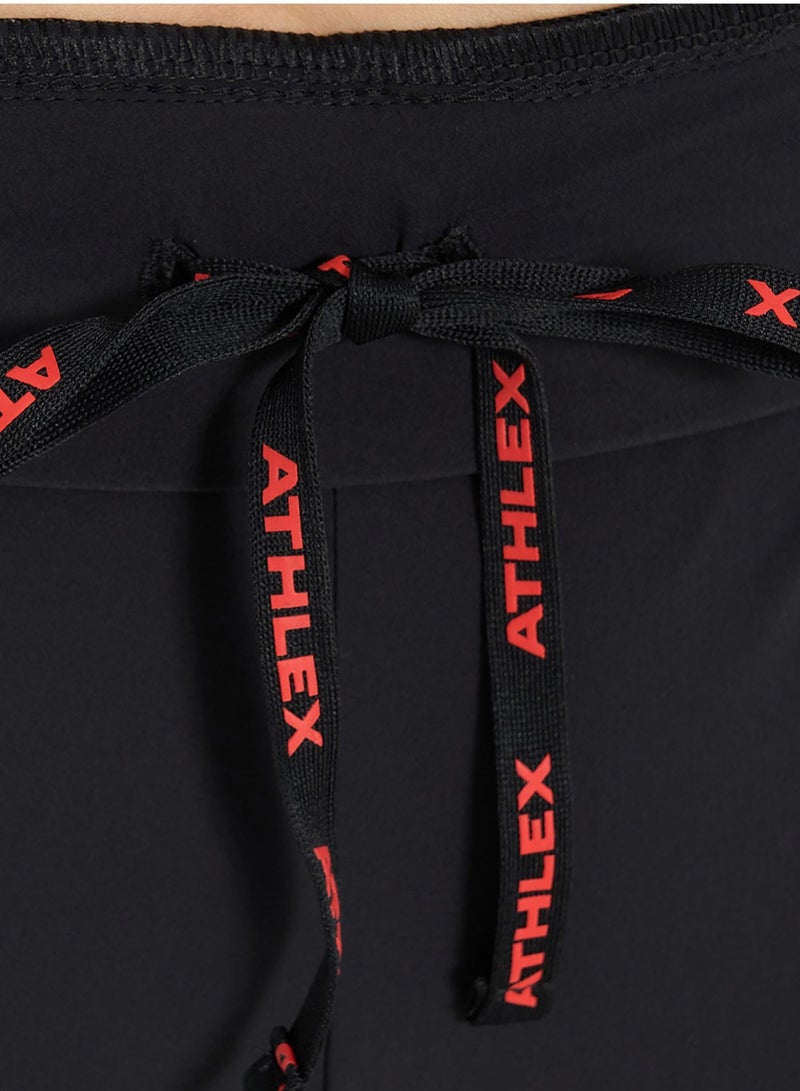 Athlex Sleek Black/Red Design for Stylish Runs – The Athlex running pants in black and red combine bold design with high-performance features. Ideal for women runners, these pants offer a perfect blend of style, comfort, and functionality during every run. - Image 5