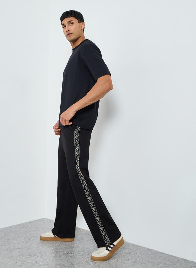 Styli Men Black Oversized Terry Printed Panel Joggers - Image 2