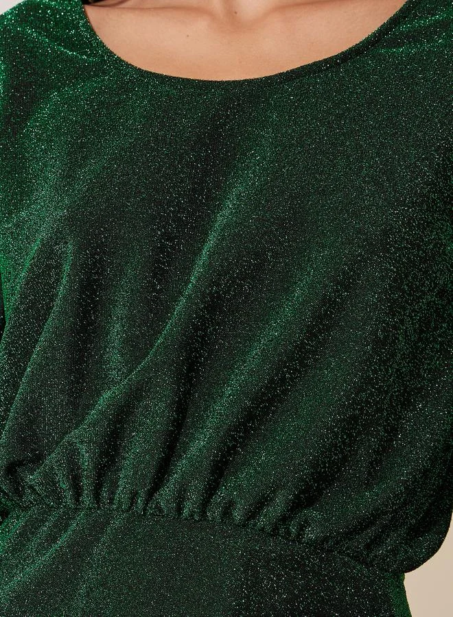 تايك تو فستان زمردي لامع