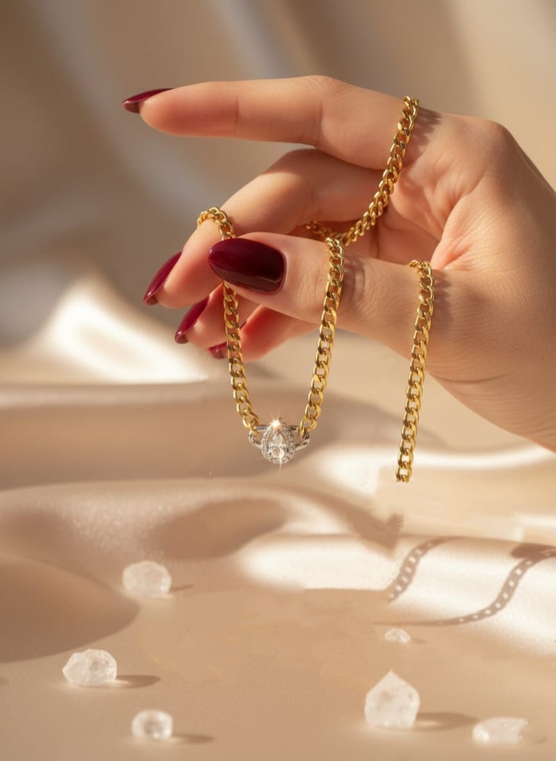 A wide gold-plated chain necklace featuring a teardrop or pear-shaped pendant. It shines in a shiny silver finish and comes with additional links for adjusting the size. - Image 2