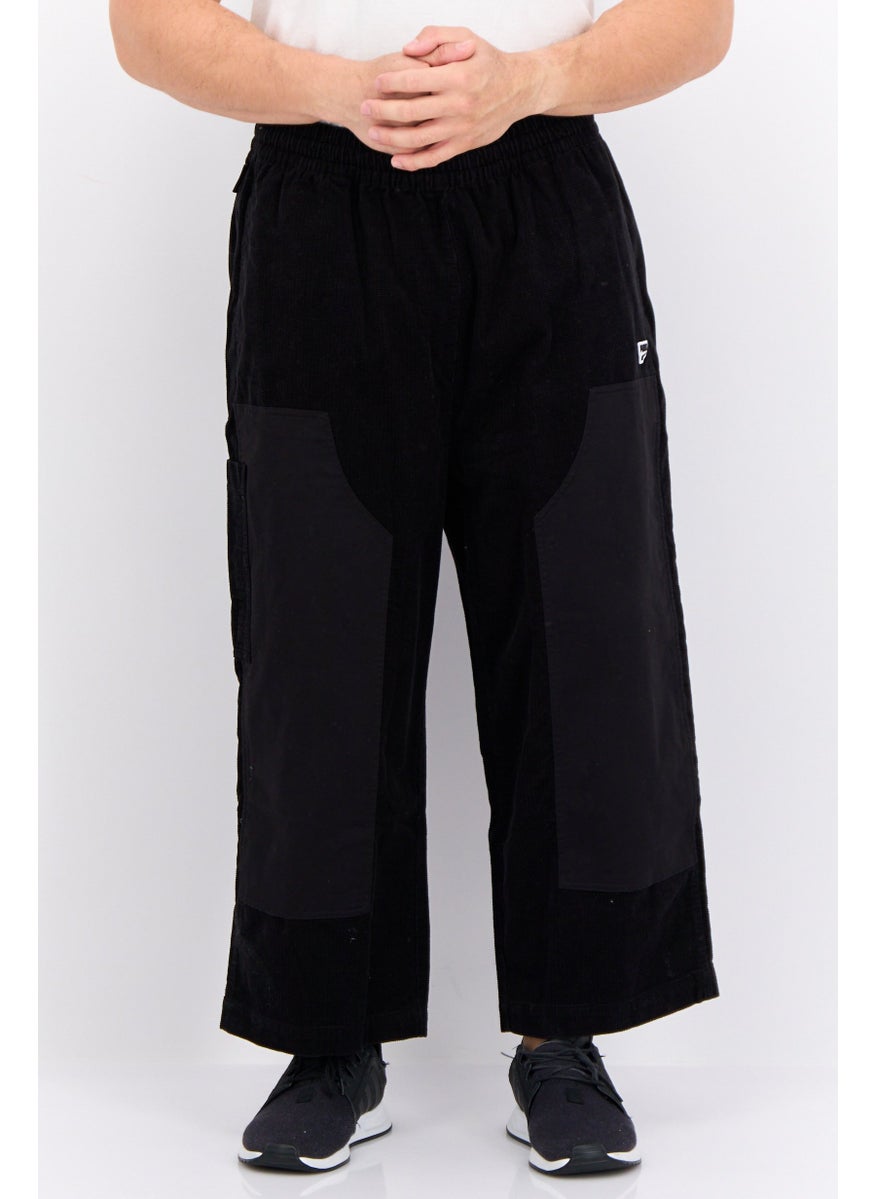 PUMA Men Sportswear Fit Brand Logo Outdoor Sweatpants, Black  - Image 1