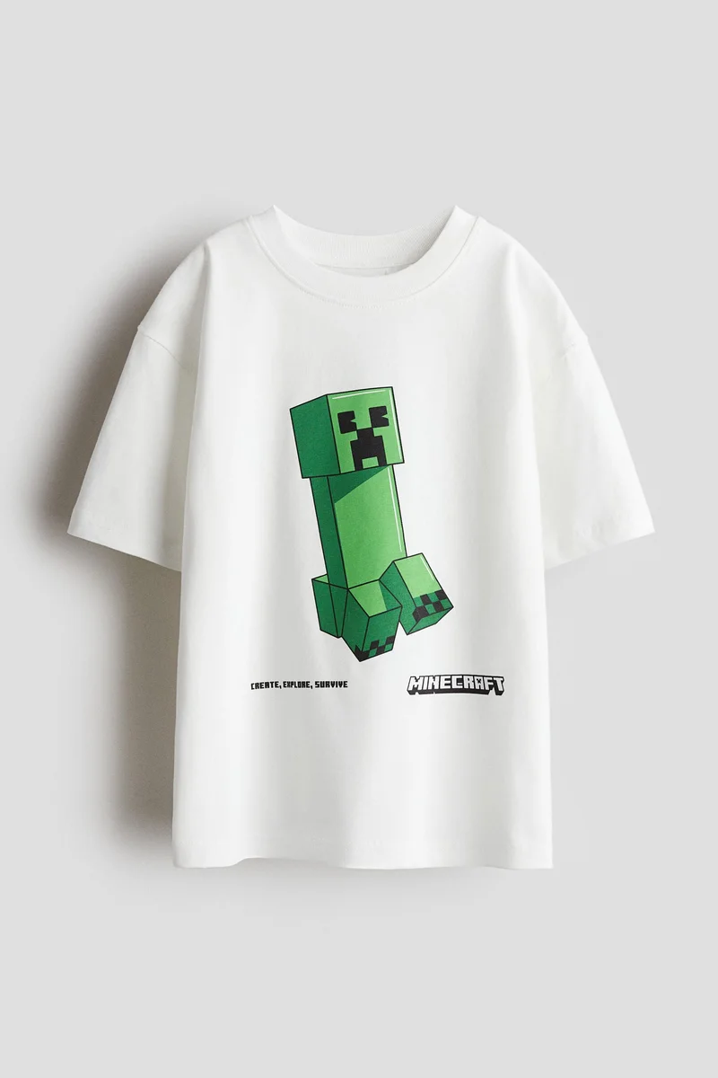 اتش اند ام تي-شيرت واسعة مزيّنة بطبعة