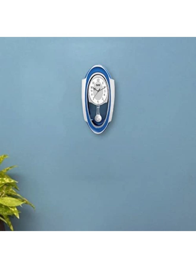 Ajanta ساعة حائط موسيقية أجنتا 1627 - زرقاء | حركة كوارتز | ألحان كل ساعة وحساس ليلي | تصميم بيضاوي أنيق | 50.7 × 24.9 سم - Image 2