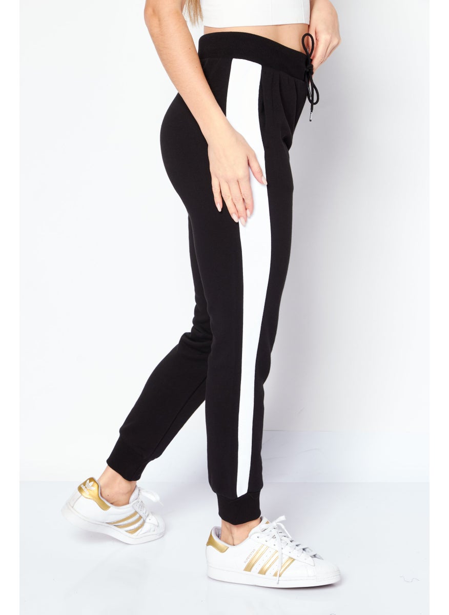 PUMA - Women Slim Fit T7 Drawstring Training Sweatpants, Black - Image 1