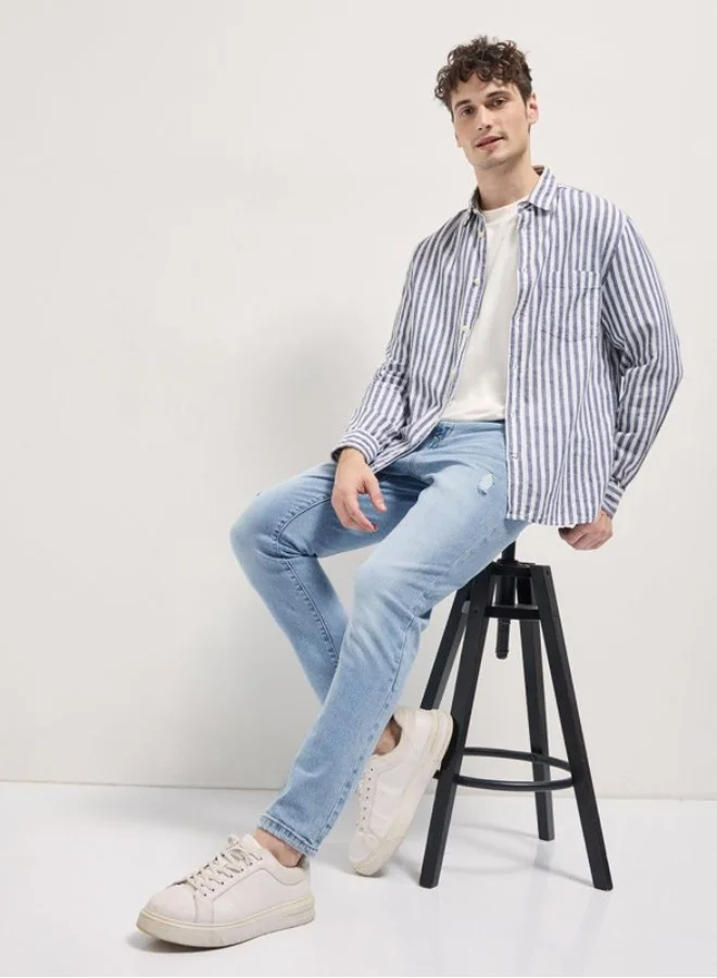 The Bear House  Men's Light Blue with Light Fade Distressed Mid-Rise Slim Fit Jeans Classic Comfort With Modern Style, Perfect For Everyday Casual Looks And Effortless Streetwear Vibes for Men | Best Price UAE