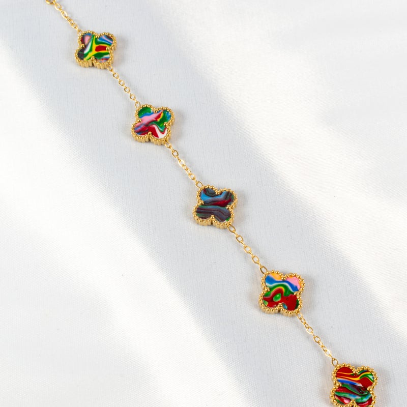 ذا بلاك بيرل اكسسوريز أنسيال أستانليس ستيل ذهبي مع شكل زهرة البرسيم بألوان خلابة - Image 2