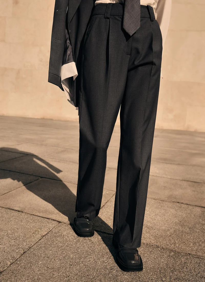 Straight cut trousers with pleats and stitched creases